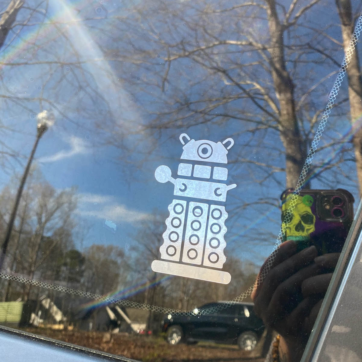 Car window with a Dalek decal.