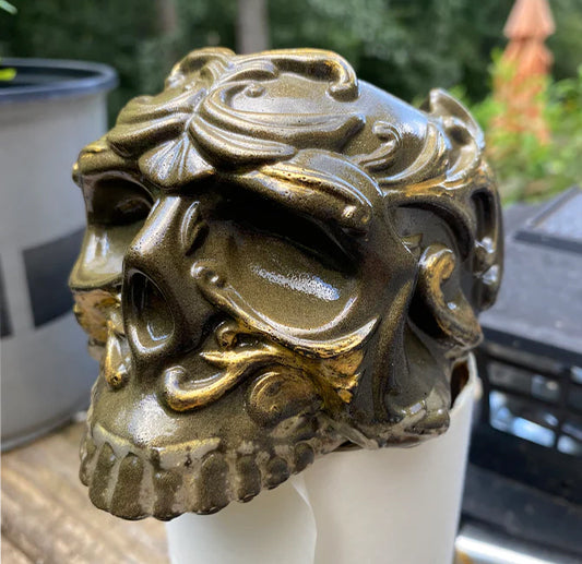 Decorative resin skull with intricate design
