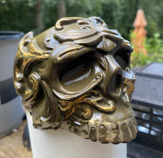 Decorative resin skull with intricate design