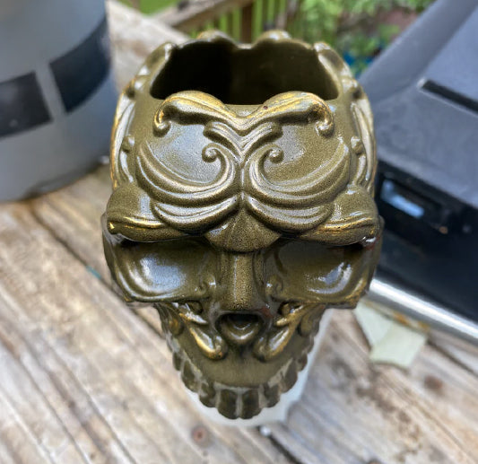 Decorative resin skull with intricate design