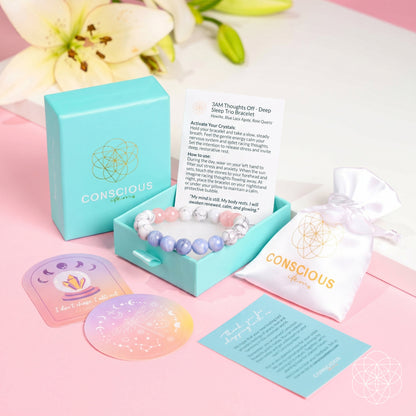 The 3AM Thoughts Off - Deep Sleep Trio Bracelet by Conscious Items is shown on a pink surface with lilies. This pastel jewelry gift set comes in a turquoise box with a white pouch, cards, and branded "CONSCIOUS." sticker.