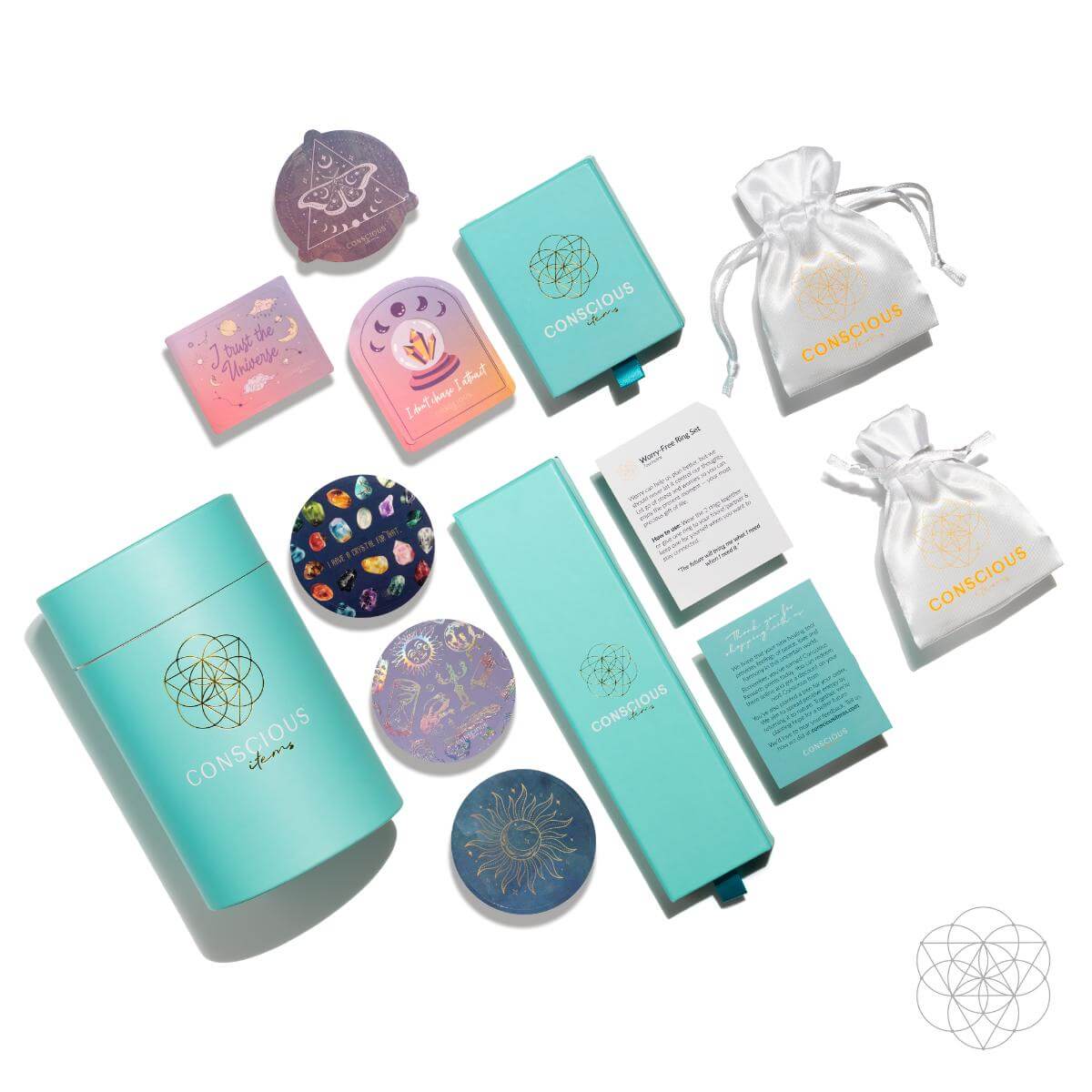 A flat lay of Conscious Items products, featuring the Repair My Heart - The Peruvian Pink Opal Bracelet, turquoise boxes, gift pouches, mystical heart-healing coasters, colorful cards, and branded packaging arranged neatly on a white background.