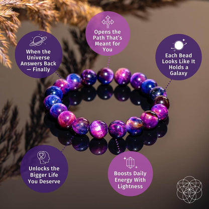 The Destiny Activator - All-Galaxy Tiger’s Eye Bracelet by Conscious Items features purple, pink, and blue marbled beads on display. Labeled bubbles highlight its cosmic destiny theme and energy-boosting powers. Blurred brown foliage accents the background.