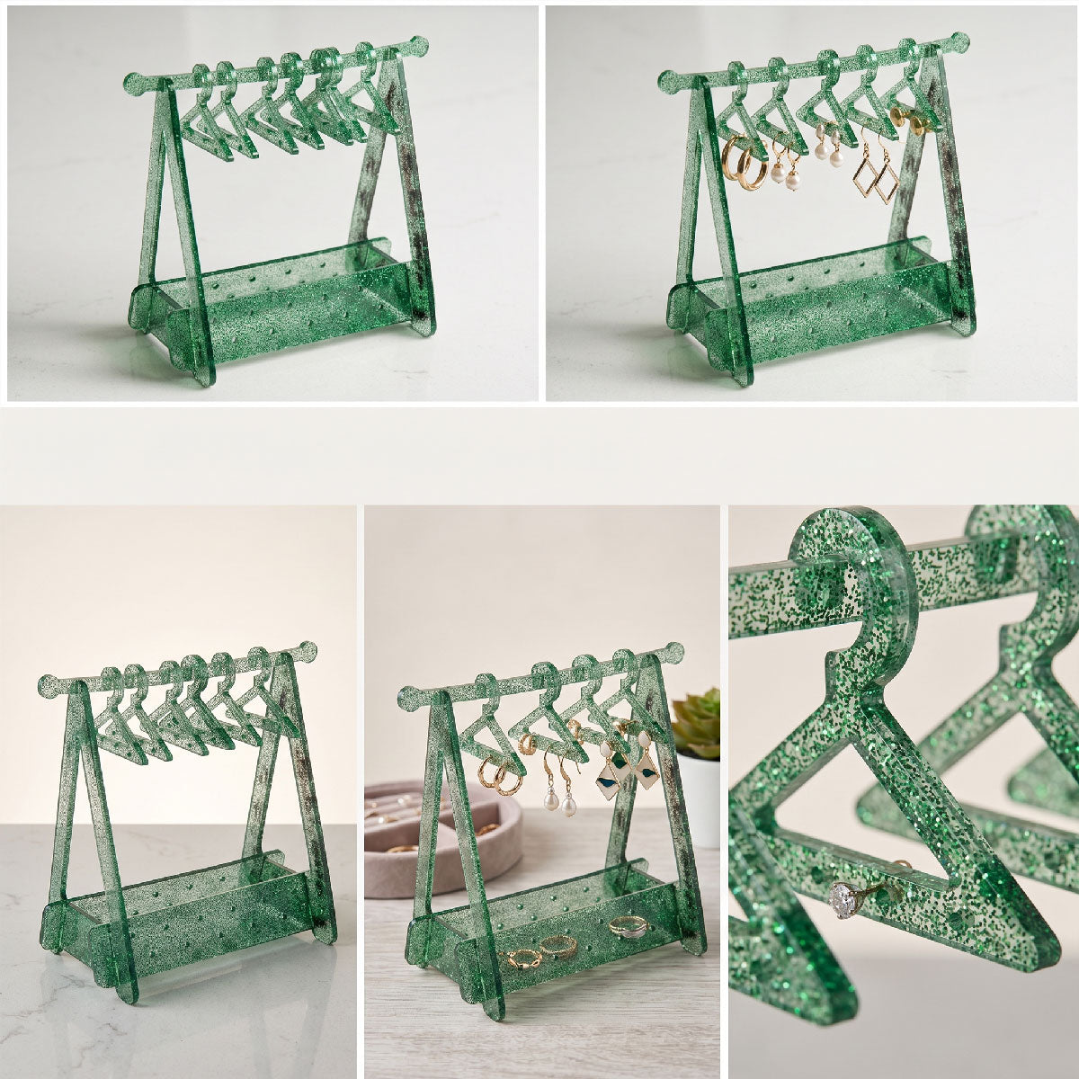 Green glittery jewelry stand with earrings on a white background