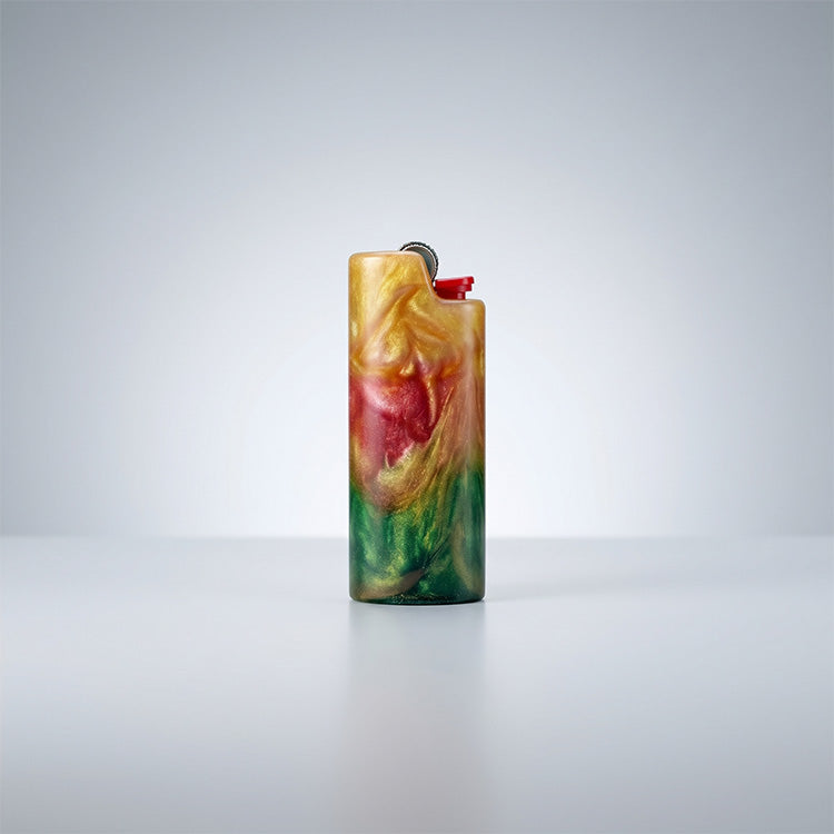 Front view of a shimmering resin lighter sleeve with a vertical gradient of gold, crimson, and green.