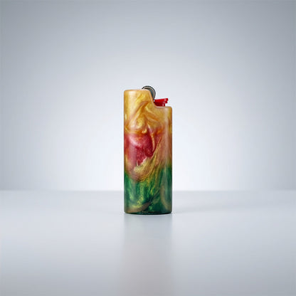 Front view of a shimmering resin lighter sleeve with a vertical gradient of gold, crimson, and green.