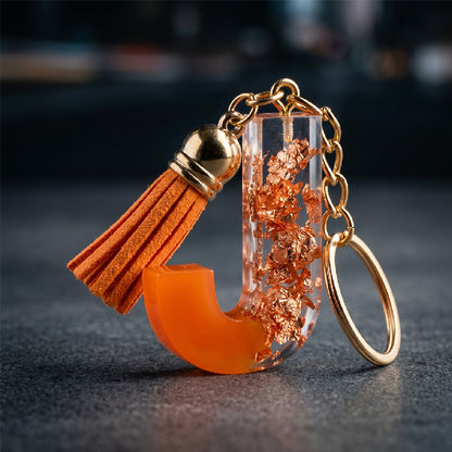 Orange Resin 'J' Keychain with Gold Flakes and Tassel